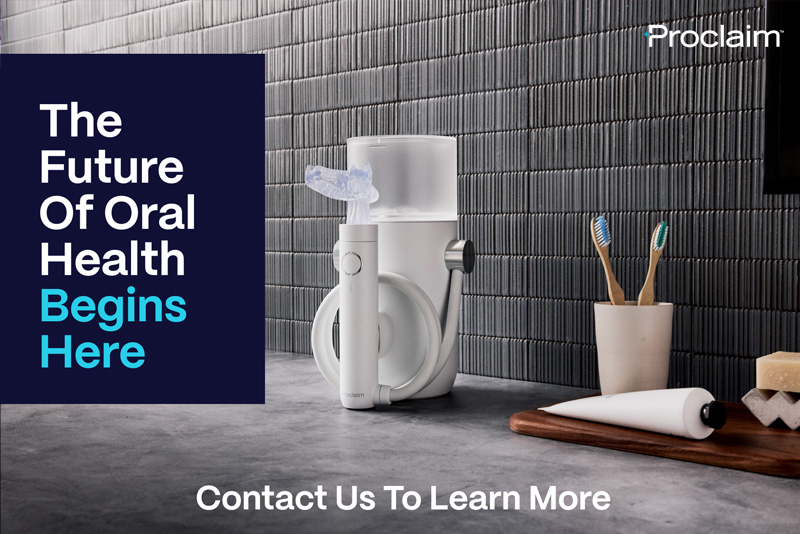 The image displays a modern electric toothbrush with two bristle heads on a countertop, next to a water glass and a toothpaste tube. In the background, there is a blue tiled wall with a white grout line, a framed picture hanging above a wooden shelf holding a potted plant, and a textured grey wall with a small portion of a white door frame visible on the right side. The image has a promotional feel, possibly for an oral health product, with a bold blue banner at the top that reads THE FUTURE OF DENTAL HEALTH BEGINS HERE and a black text overlay in the bottom left corner with white lettering that says CONTACT US TO LEARN MORE. The overall style of the image is clean, minimalistic, and suggests innovation and health.